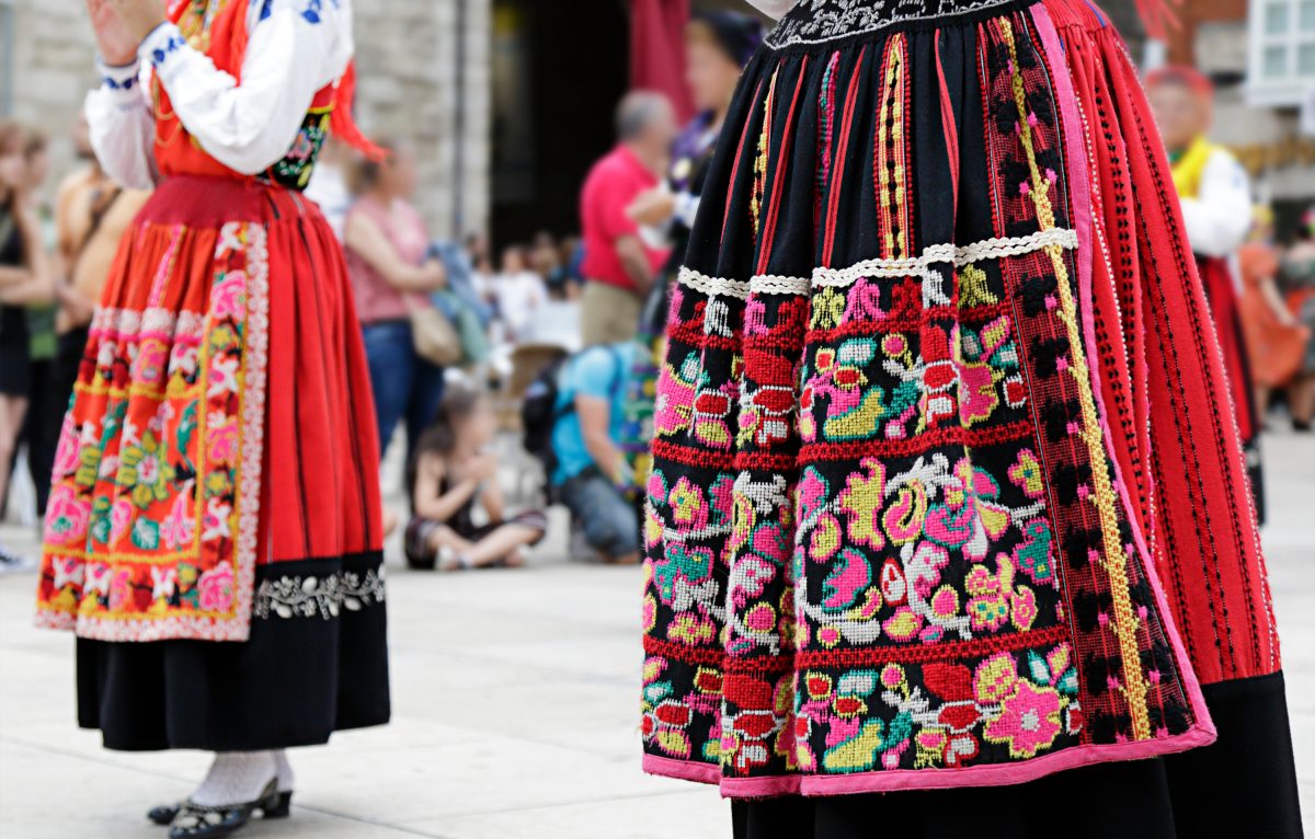 Woman dancing and wearing one of the traditional folk costume from Portugal © foire comtoise 